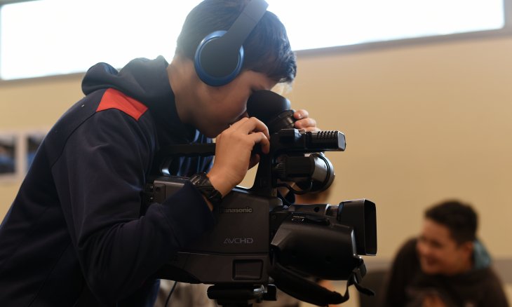 Teenagers using camera